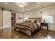 Bedroom featuring a comfortable bed, hardwood floors, natural light, and a sliding barn door closet creating a relaxing atmosphere at 5254 N Park Ave, Indianapolis, IN 46220