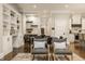 Dining room featuring a large table, built-in shelving, and views to the kitchen and living room at 5254 N Park Ave, Indianapolis, IN 46220