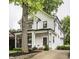 Beautifully landscaped home boasting modern design and a covered front porch at 5254 N Park Ave, Indianapolis, IN 46220