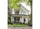 Charming two-story modern farmhouse featuring black window trim and inviting front porch at 5254 N Park Ave, Indianapolis, IN 46220