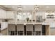 Modern kitchen featuring a spacious island, bar seating, stainless steel appliances, and custom backsplash at 5254 N Park Ave, Indianapolis, IN 46220