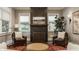 Inviting living room showcasing a tiled fireplace, hardwood floors, and large windows at 5254 N Park Ave, Indianapolis, IN 46220