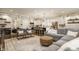 Open concept floor plan featuring kitchen, dining area, and living room with hardwood floors and neutral paint at 5254 N Park Ave, Indianapolis, IN 46220
