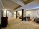 Finished basement featuring neutral walls, plush carpeting, and stylish furniture arrangements at 5347 Sampson Dr, Indianapolis, IN 46237