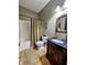 Cozy bathroom featuring a vanity with a vessel sink and a shower with a patterned curtain at 5347 Sampson Dr, Indianapolis, IN 46237
