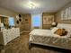 Cozy bedroom with soft carpet, a world map, and a white-painted dresser and bed at 5347 Sampson Dr, Indianapolis, IN 46237