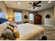 Relaxing bedroom featuring neutral paint, carpeting, natural light, and a decorative ceiling fan at 5347 Sampson Dr, Indianapolis, IN 46237