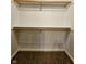 Walk-in closet featuring wood shelving and carpeted flooring at 5347 Sampson Dr, Indianapolis, IN 46237