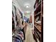 Spacious walk-in closet featuring custom shelving and hanging storage at 5347 Sampson Dr, Indianapolis, IN 46237