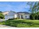 Charming single-story white brick home featuring a well-manicured front lawn at 5347 Sampson Dr, Indianapolis, IN 46237