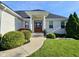 A close up of the front of the home showing a front door with an intricate design and a well-manicured lawn at 5347 Sampson Dr, Indianapolis, IN 46237