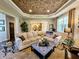 Bright and inviting living room featuring natural light, an open layout, and tray ceiling at 5347 Sampson Dr, Indianapolis, IN 46237