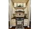 Close-up of kitchen appliance with granite countertop and tile backsplash at 5347 Sampson Dr, Indianapolis, IN 46237