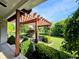 Backyard featuring a pergola-covered patio with outdoor seating and lush landscaping, perfect for relaxing and entertaining at 5347 Sampson Dr, Indianapolis, IN 46237
