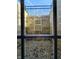 Exterior view of a window well with a ladder for emergency escape in a partially finished basement at 5347 Sampson Dr, Indianapolis, IN 46237