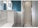 Bathroom featuring white tiled walls, glass shower, and vanity with drawers and cabinet at 5430 N Washington Blvd, Indianapolis, IN 46220