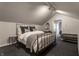 Finished attic bedroom with a sloped ceiling, neutral tones, and recessed lighting at 5430 N Washington Blvd, Indianapolis, IN 46220