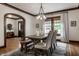 Dining room featuring a farmhouse style dining table with chairs, a bench, and hardwood floors with area rug at 5430 N Washington Blvd, Indianapolis, IN 46220