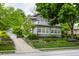 Beautiful two-story home with well-manicured landscaping and a charming balcony at 5430 N Washington Blvd, Indianapolis, IN 46220