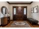 Elegant foyer featuring a decorative rug, wood floors, and stylish furnishings at 5430 N Washington Blvd, Indianapolis, IN 46220