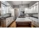 Updated kitchen featuring a marble island, modern appliances, and custom cabinetry at 5430 N Washington Blvd, Indianapolis, IN 46220