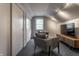 Finished attic with two chairs, TV, overhead lighting, and finished flooring at 5430 N Washington Blvd, Indianapolis, IN 46220