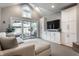 Bright living room with built-in cabinets, a large sectional, and a sliding glass door to the patio at 5430 N Washington Blvd, Indianapolis, IN 46220