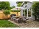Outdoor patio featuring a dining table set, grill, and a large umbrella perfect for backyard entertaining at 5430 N Washington Blvd, Indianapolis, IN 46220