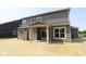 Backyard of a two-story home with a covered patio and new sod at 5517 Sienna Ct, Brownsburg, IN 46112