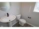 New powder room featuring modern fixtures, a sleek vanity, and contemporary design at 5517 Sienna Ct, Brownsburg, IN 46112