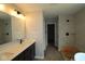 Bathroom with modern vanity, sleek fixtures, and tiled shower at 5517 Sienna Ct, Brownsburg, IN 46112