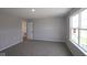 Bedroom with plush carpeting, natural light, and closet space at 5517 Sienna Ct, Brownsburg, IN 46112