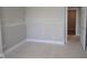 Unfinished bedroom showcasing base trim and doorway at 5517 Sienna Ct, Brownsburg, IN 46112