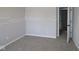 Bedroom with plush carpeting, neutral walls, and an open doorway at 5517 Sienna Ct, Brownsburg, IN 46112