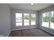 Bright bedroom with three large windows and light gray walls, awaiting final finishes at 5517 Sienna Ct, Brownsburg, IN 46112