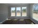 Bedroom with three windows providing natural light and views of the surrounding landscape, ready for customization at 5517 Sienna Ct, Brownsburg, IN 46112