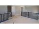 Interior hallway showcasing staircase railings and multiple doorways, indicating a well-designed floor plan at 5517 Sienna Ct, Brownsburg, IN 46112