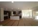 Large, open living area adjacent to the kitchen, featuring natural light and contemporary design elements at 5517 Sienna Ct, Brownsburg, IN 46112