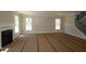 Bright living room with a fireplace, large windows, and neutral tones, awaiting personalization and decor at 5517 Sienna Ct, Brownsburg, IN 46112