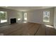 Spacious living room with a fireplace awaiting customization and flooring at 5517 Sienna Ct, Brownsburg, IN 46112