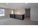 Spacious loft area with a modern chandelier and natural light at 5517 Sienna Ct, Brownsburg, IN 46112