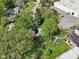 Aerial view displaying the home nestled between mature trees, offering natural beauty and privacy at 6210 Mckinley Ct, Indianapolis, IN 46220