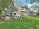 View of a spacious backyard with a deck and lush green lawn, perfect for outdoor activities and relaxation at 6210 Mckinley Ct, Indianapolis, IN 46220