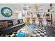 Recreational basement featuring comfortable seating and a bar with barstools at 6210 Mckinley Ct, Indianapolis, IN 46220