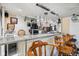 Basement bar area with counter seating and ample storage at 6210 Mckinley Ct, Indianapolis, IN 46220