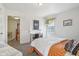 Bright bedroom with a desk and window, creating a functional and inviting space at 6210 Mckinley Ct, Indianapolis, IN 46220