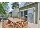Outdoor deck with dining set, access to the home, and a clear view of the backyard at 6210 Mckinley Ct, Indianapolis, IN 46220
