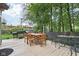 Spacious outdoor deck with a grill, dining set, and ample seating areas at 6210 Mckinley Ct, Indianapolis, IN 46220