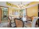 Inviting dining room featuring a round table, stylish wicker chairs, and abundant natural light at 6210 Mckinley Ct, Indianapolis, IN 46220