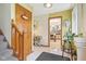 Bright entryway with tiled floors, staircase and doorway to kitchen, creates a welcoming first impression at 6210 Mckinley Ct, Indianapolis, IN 46220